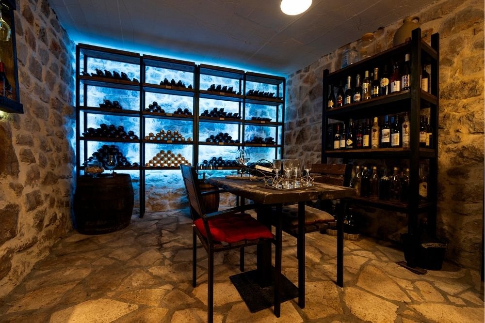 Family-made wine served to adult guests during a countryside dinner near Herceg Novi